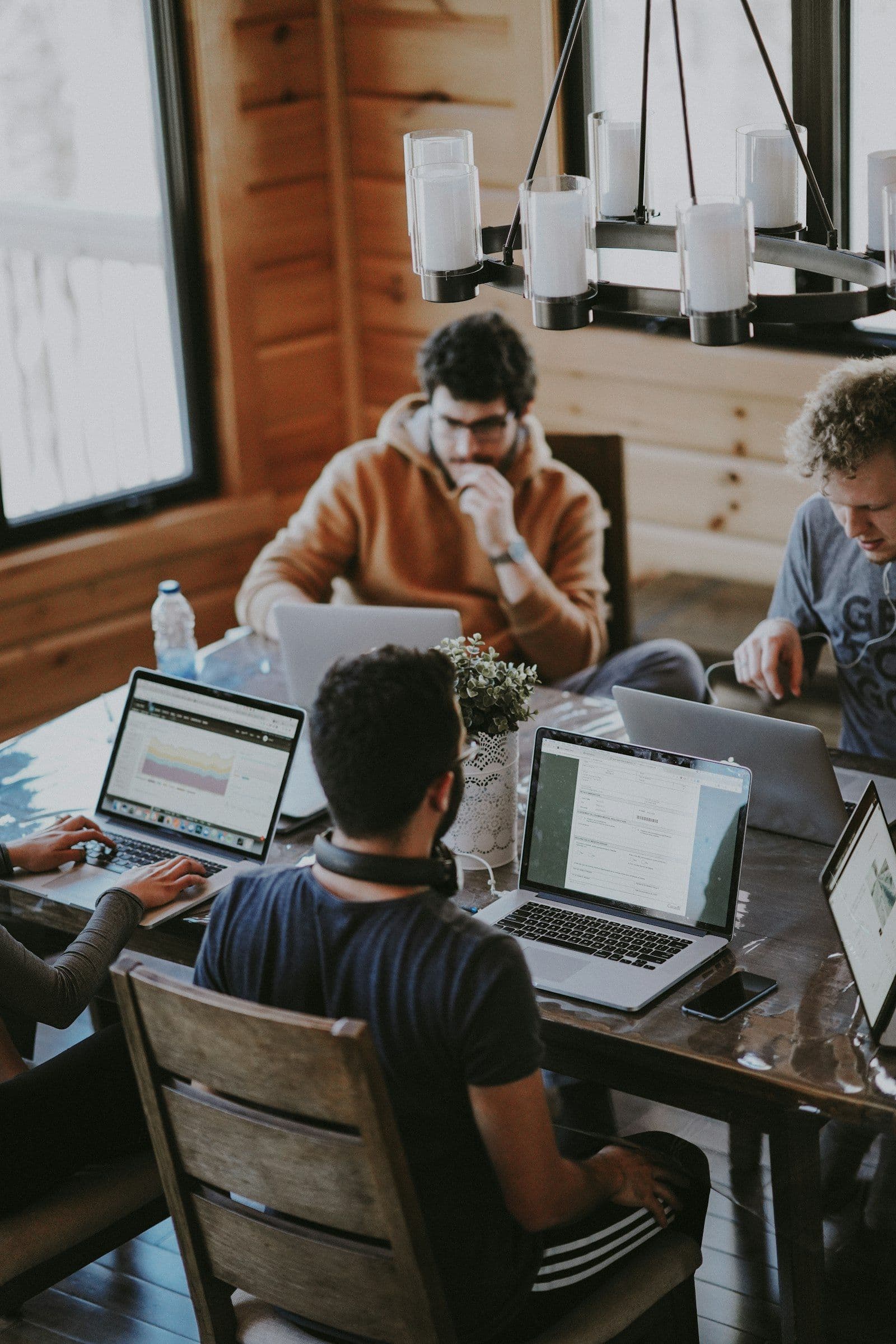 A sales team in conversation around a table